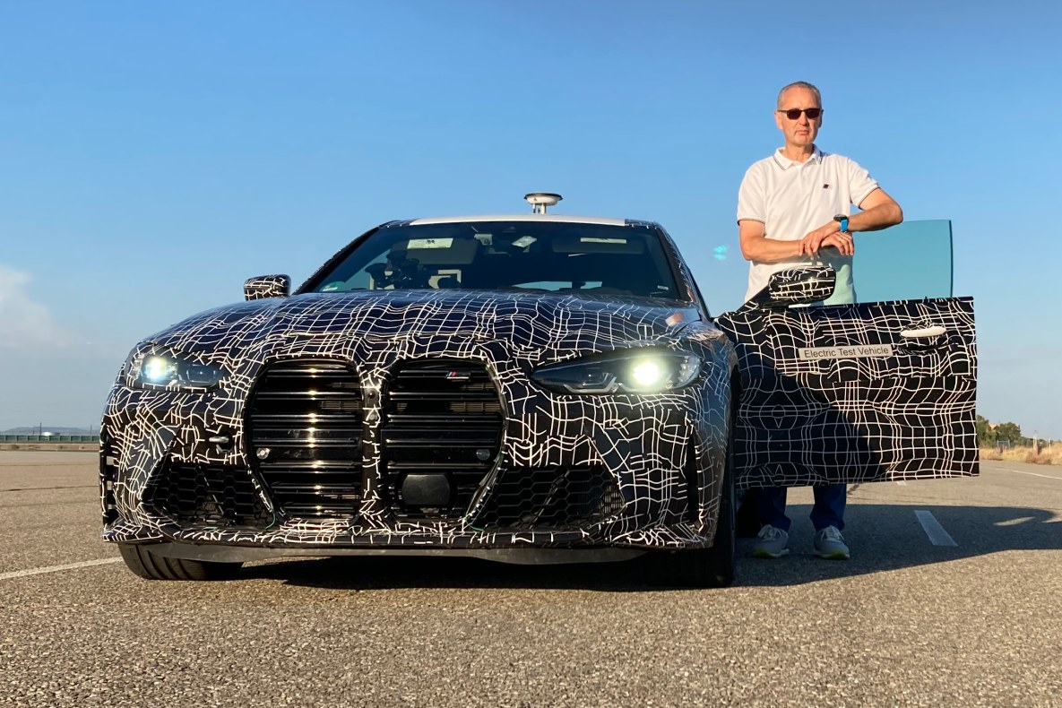 Dirk Häcker next to the BMW M all-electric high-performance prototype