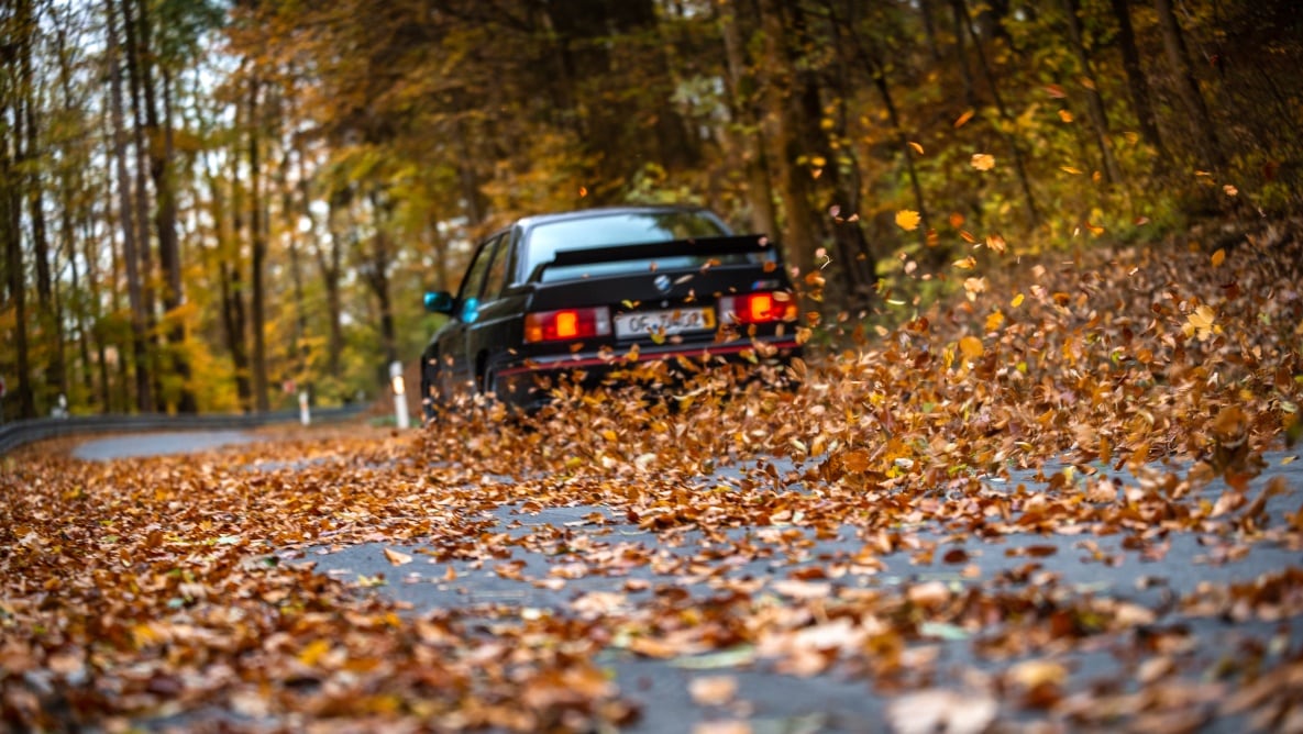 E30 BMW M3 Sport Evolution E30 BMW M3 Sport Evolution driving on a road in autumn