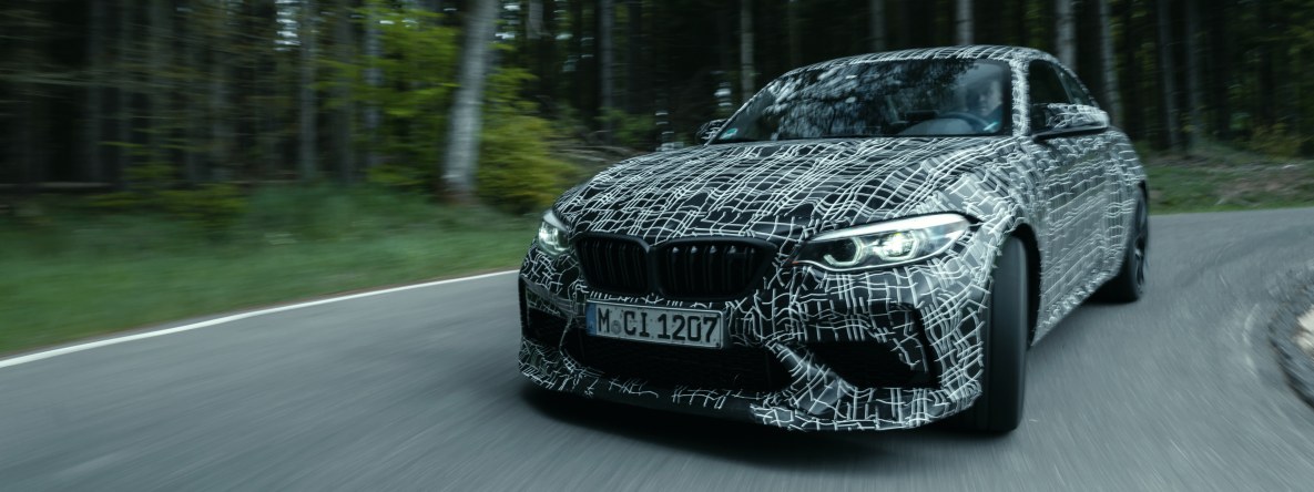 The BMW M2 CS prototype on a narrow road in the Eifel mountains