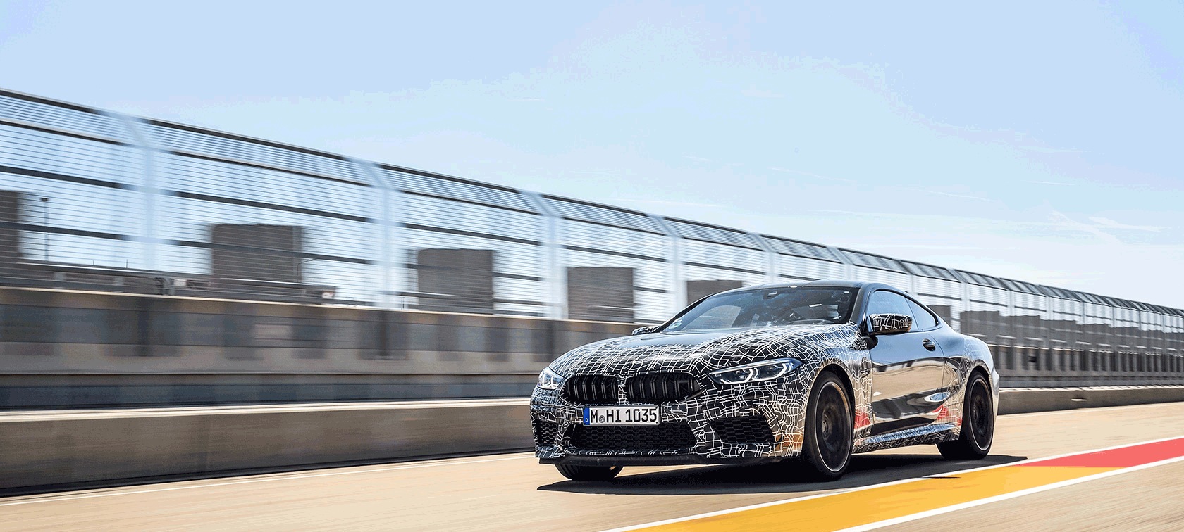 New BMW M8 Coupé with camouflage on a race track