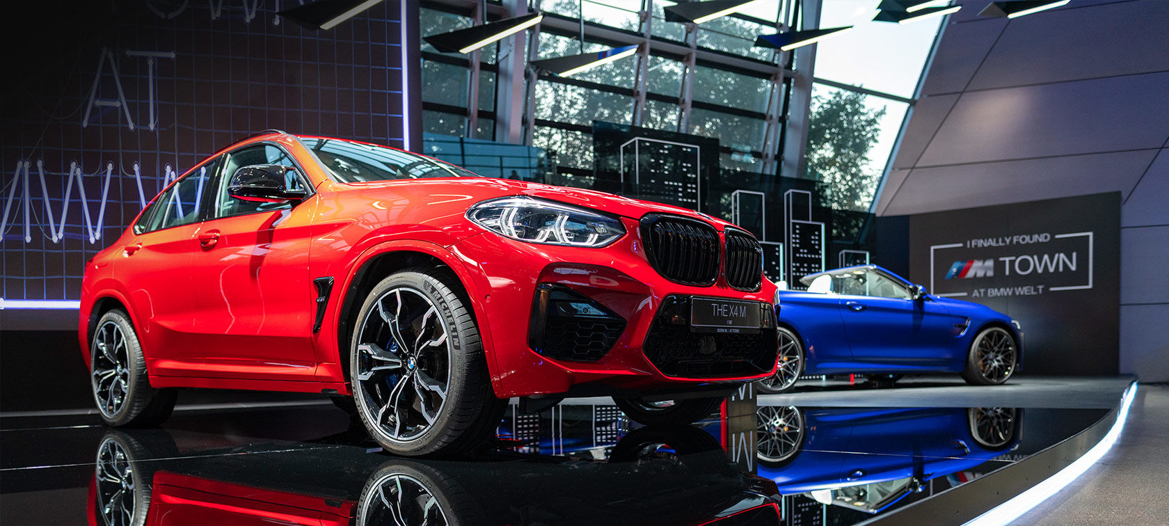 A red BMW X4 M at M Town exhibition at BMW Welt