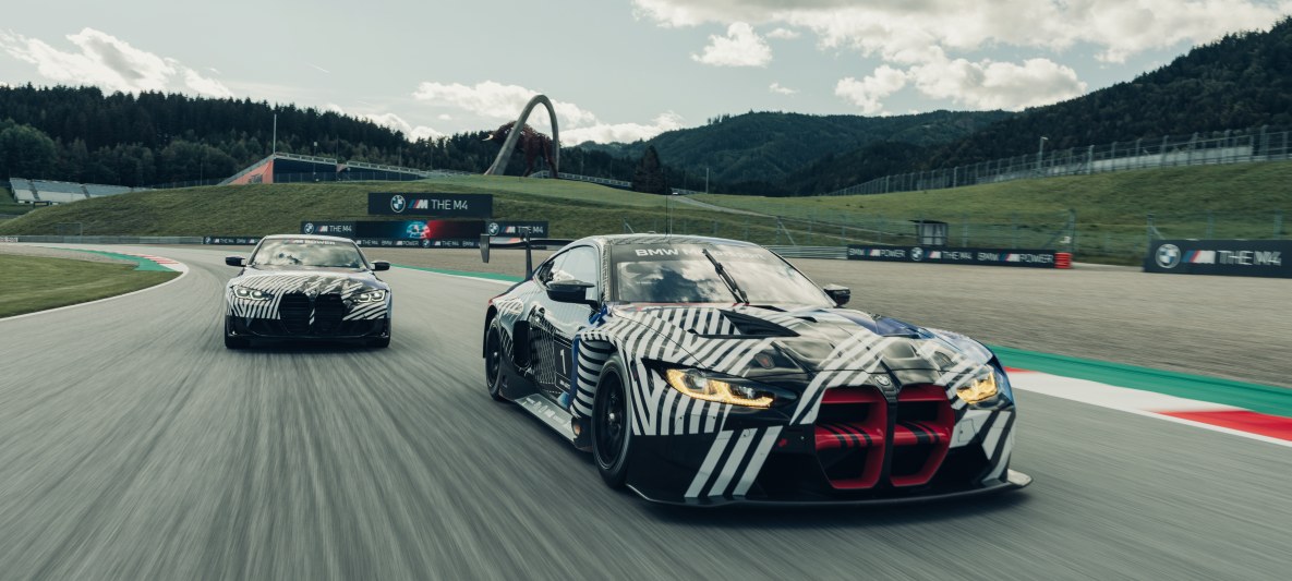 BMW M4 and BMW M4 GT3 The all-new BMW M4 and BMW M4 GT3 race car driving on Red Bull Ring, Austria