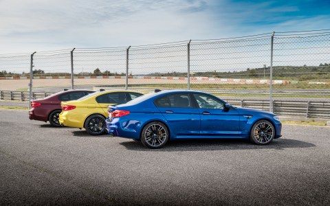 Three BMW M5 automobiles with BMW Individual equipment