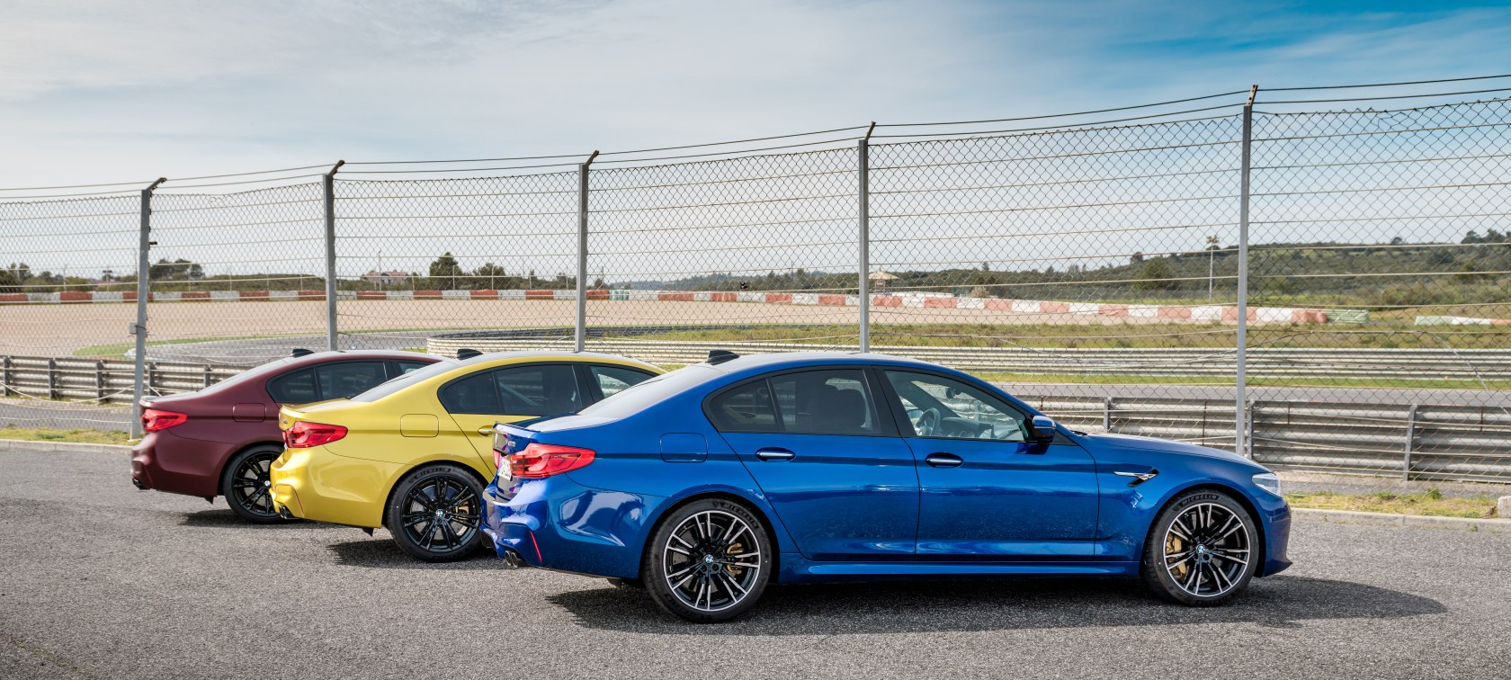Three BMW M5 automobiles with BMW Individual equipment