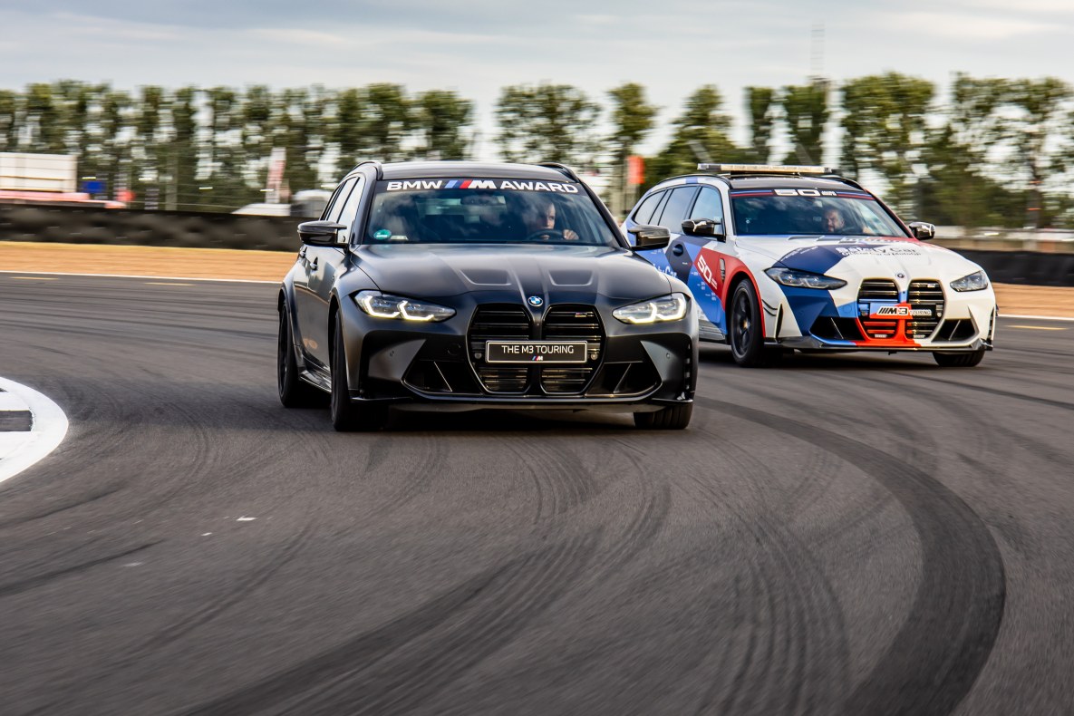 The BMW M3 Touring and the BMW M3 Touring MotoGP™ Safety Car together on the race track.