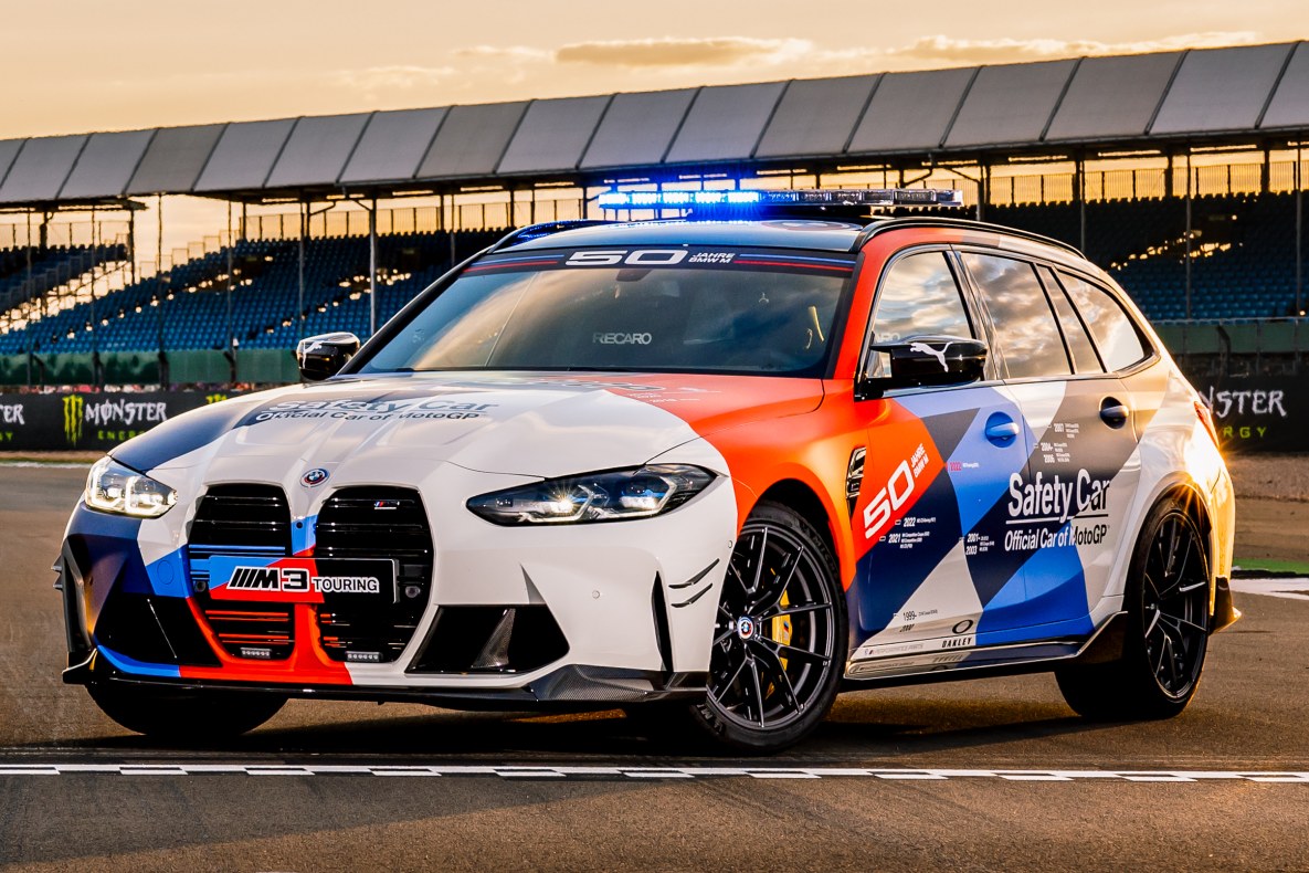 The BMW M3 Touring MotoGP™ Safety Car standing on the race track.