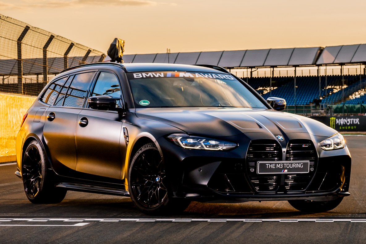 The BMW M3 Touring in semi-profile standing on the race track.