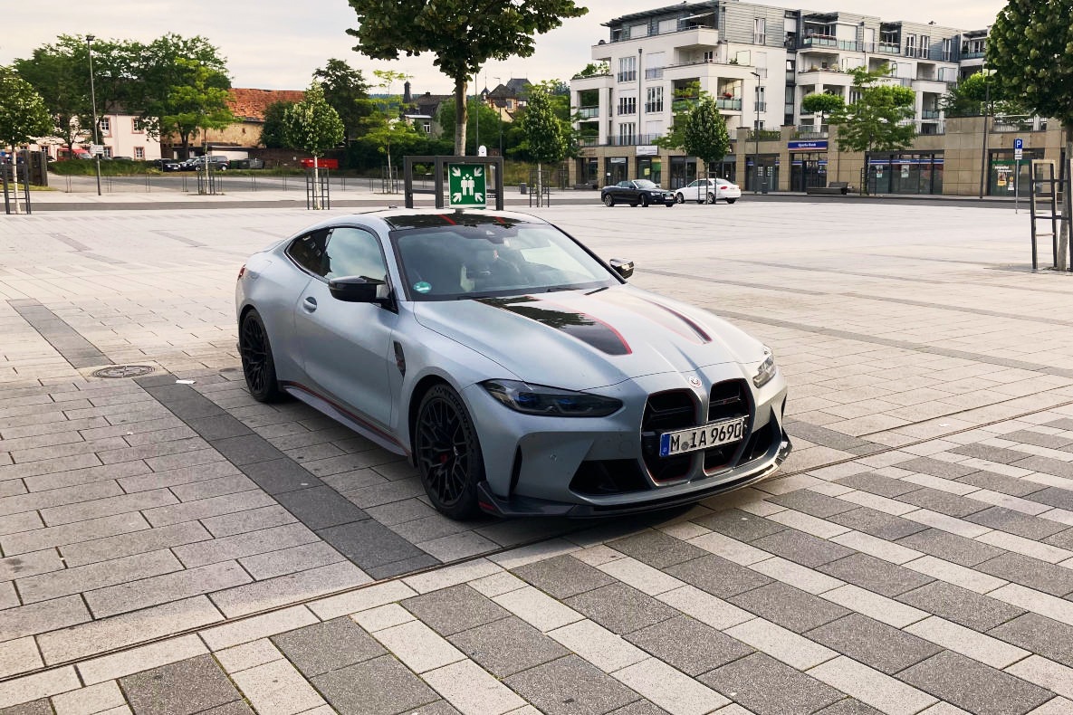 The BMW M4 CSL during a stopover in a car park.