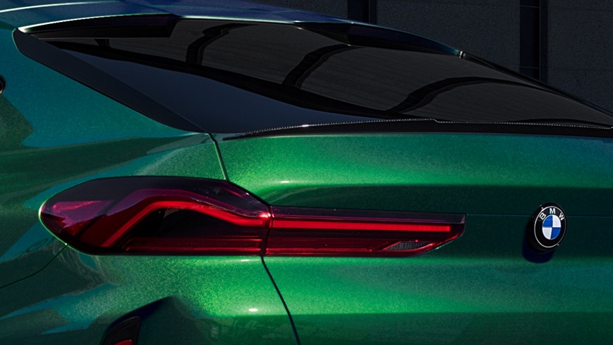 BMW X6 M Competition in BMW Individual Aurora Diamond Green metallic.