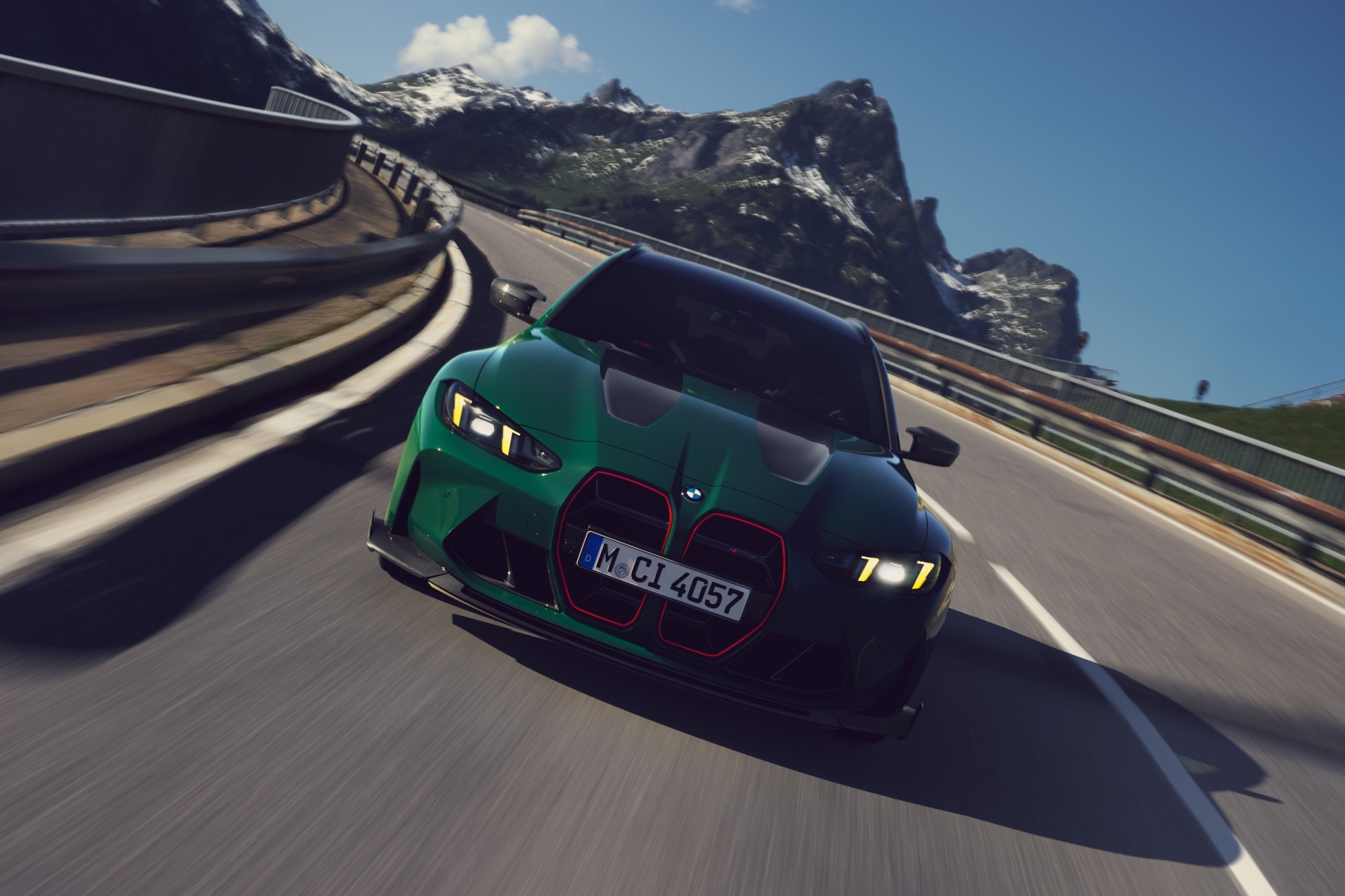 BMW M3 CS Touring in British Racing Green driving on a mountain road