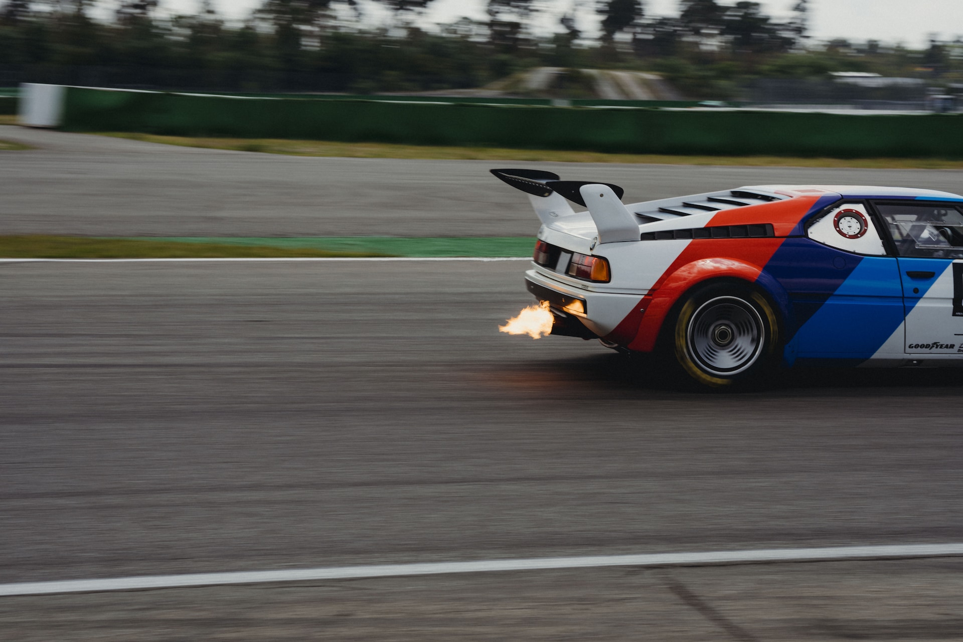 Exhaust flames BMW M1 Procar BMW Motorsport livery rear view at the Hockenheimring