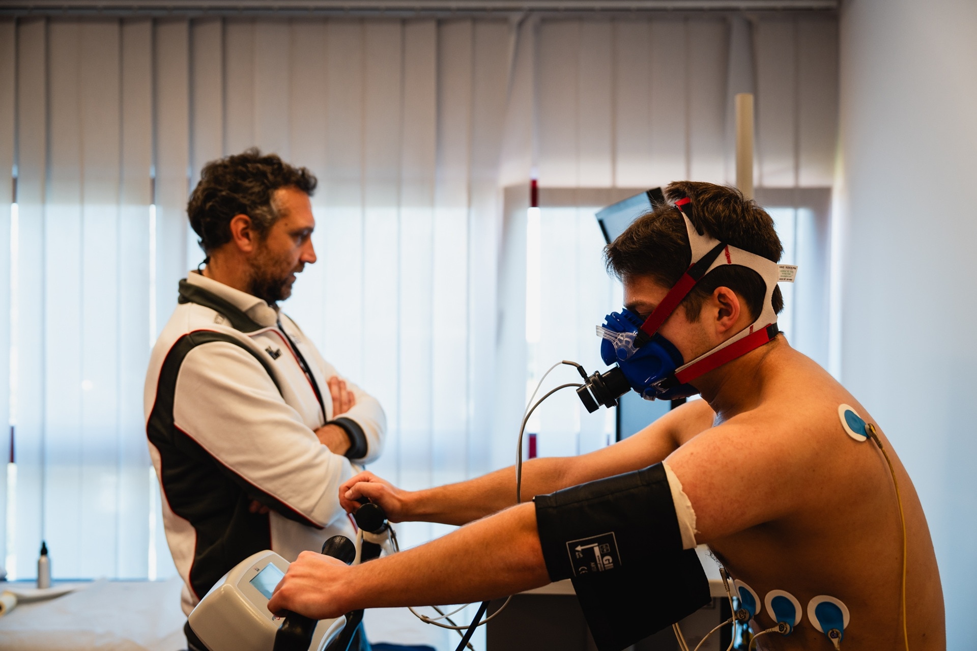 Oxygen saturation, pulse and blood pressure precisely monitored: 22-year-old BMW M Racing Academy participant Nils Tröger (GER), BMW M4 GT4 driver for FK Performance Motorsport, during cardio training in Formula Medicine's special gym.