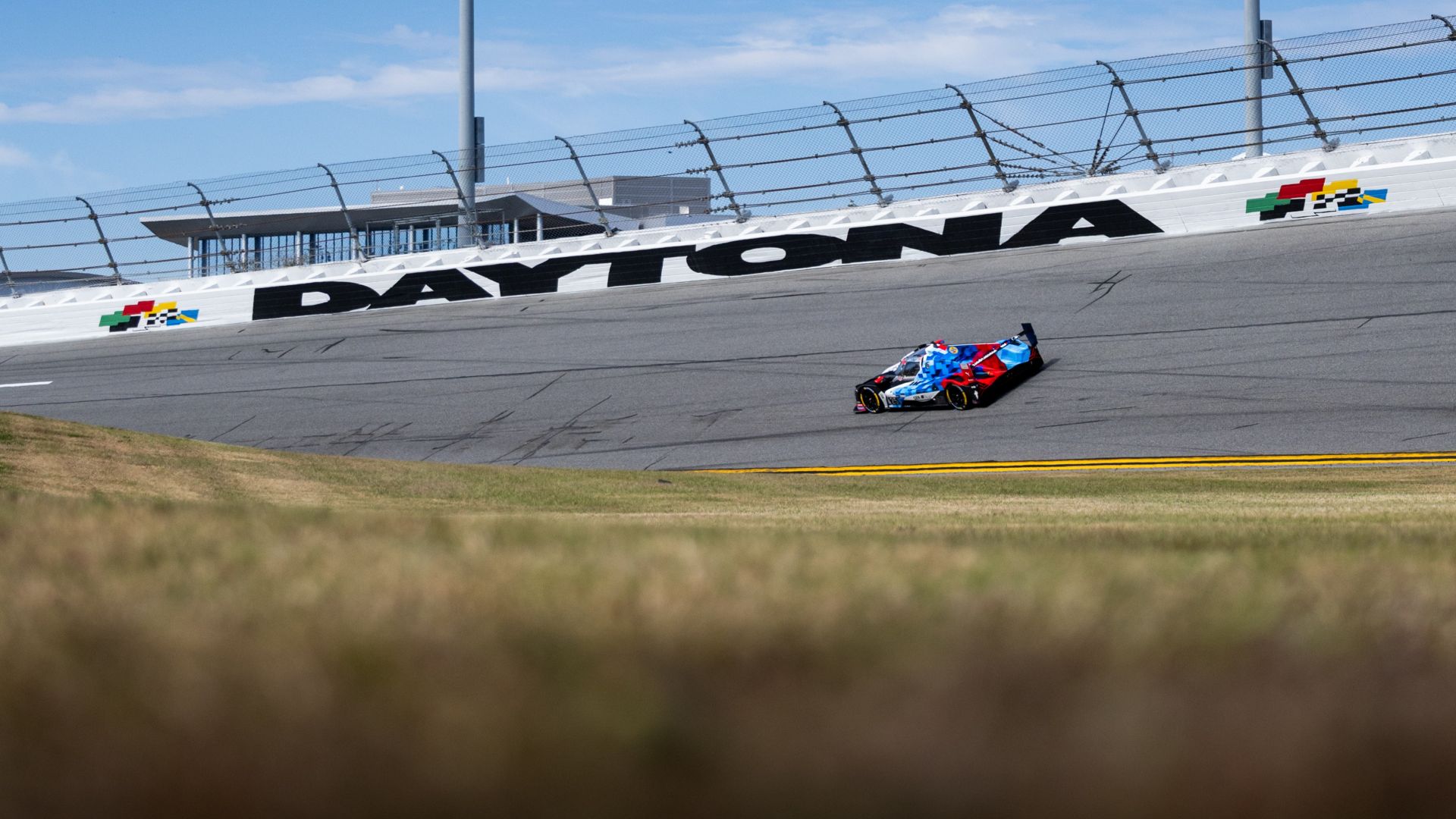 BMW M Hybrid V8 speeding on the racetrack at Daytona. 