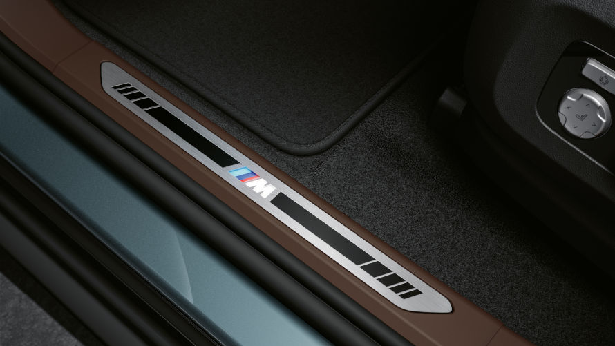Exclusive details: Illuminated front and rear door sill plates crafted from brushed aluminium and bearing the M logo.