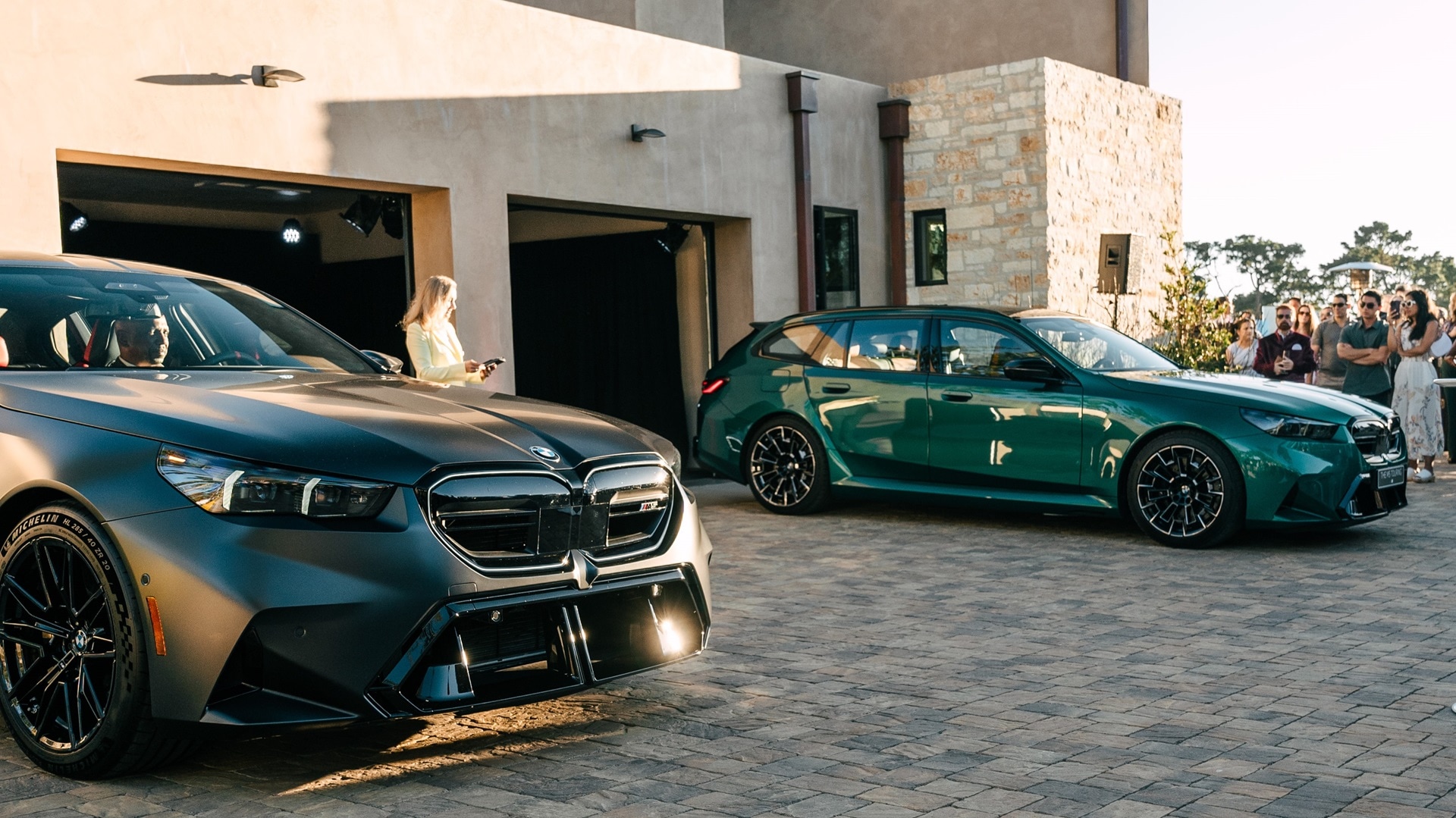 Guests enjoying a double presentationat the BMW Villa in Monterey.: the M5 Sedan and Touring.