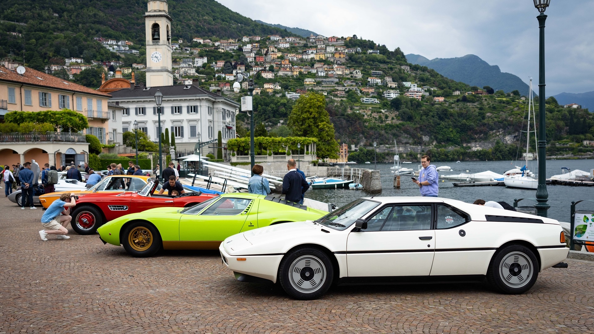 Participant vehicles at Cernobbio harbor in 2023.