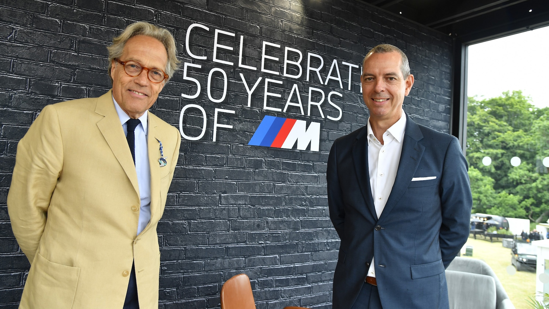The 11th Duke of Richmond (L) with the CEO of BMW M, Franciscus van Meel, 2022.