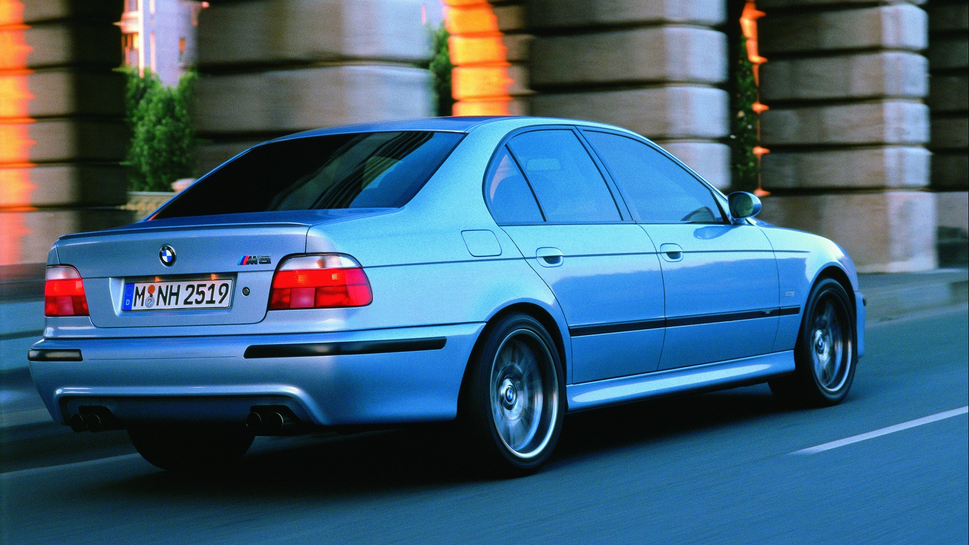 Silver BMW M5 E39 on an urban street