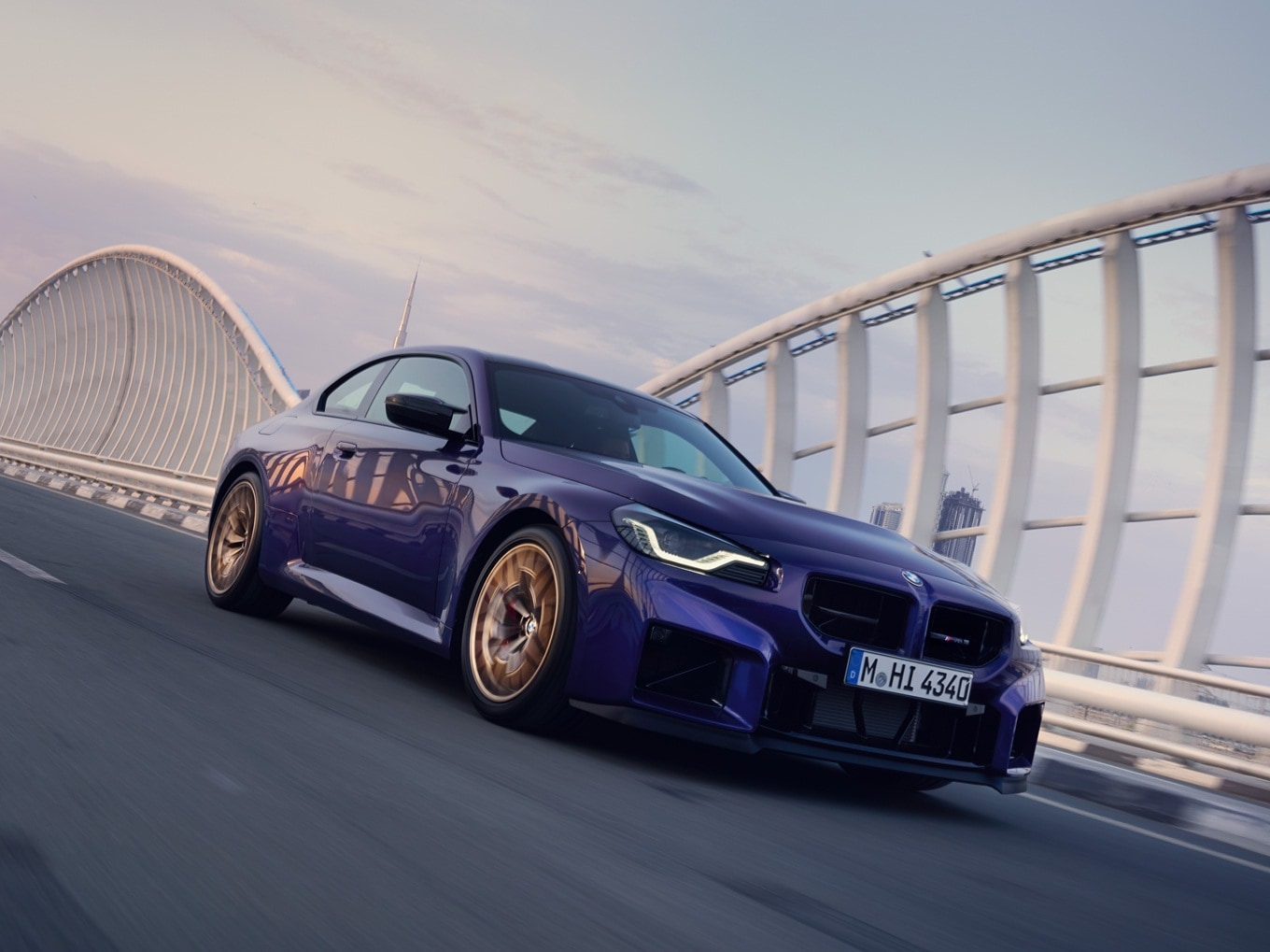 BMW M2 CS driving on a bridge.