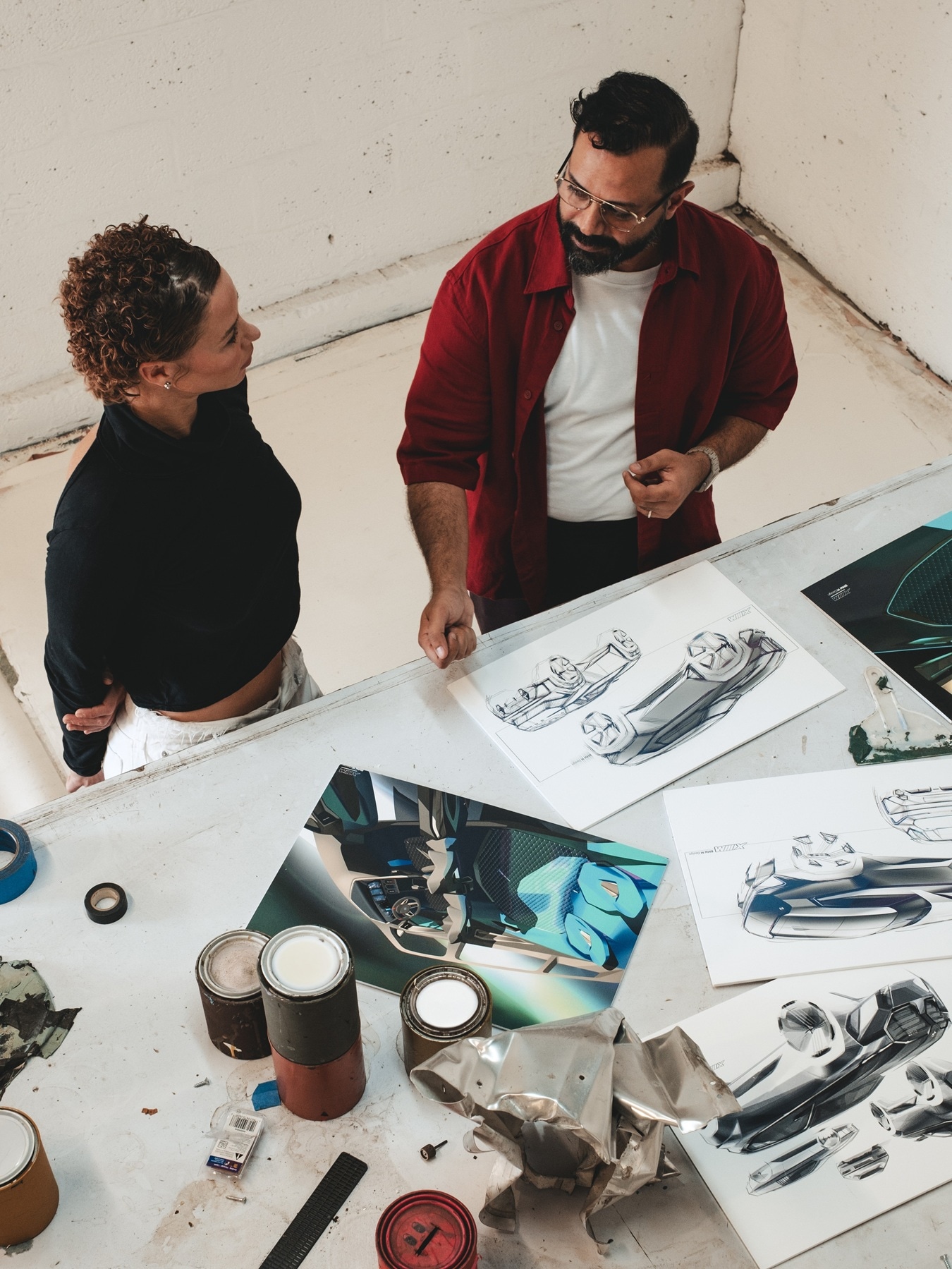 Kennedy Yanko and Hussein Al Attar discussing concepts.