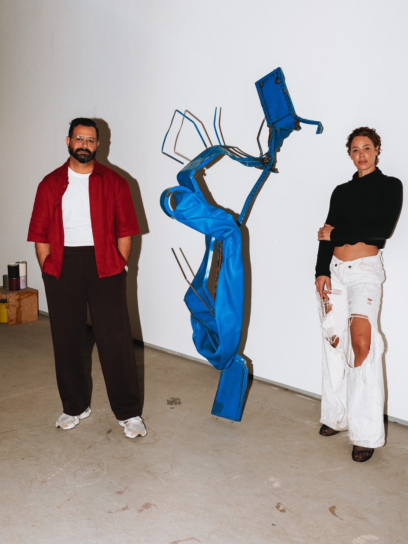 Kennedy Yanko and Hussein Al Attar with Yanko's sculpture.