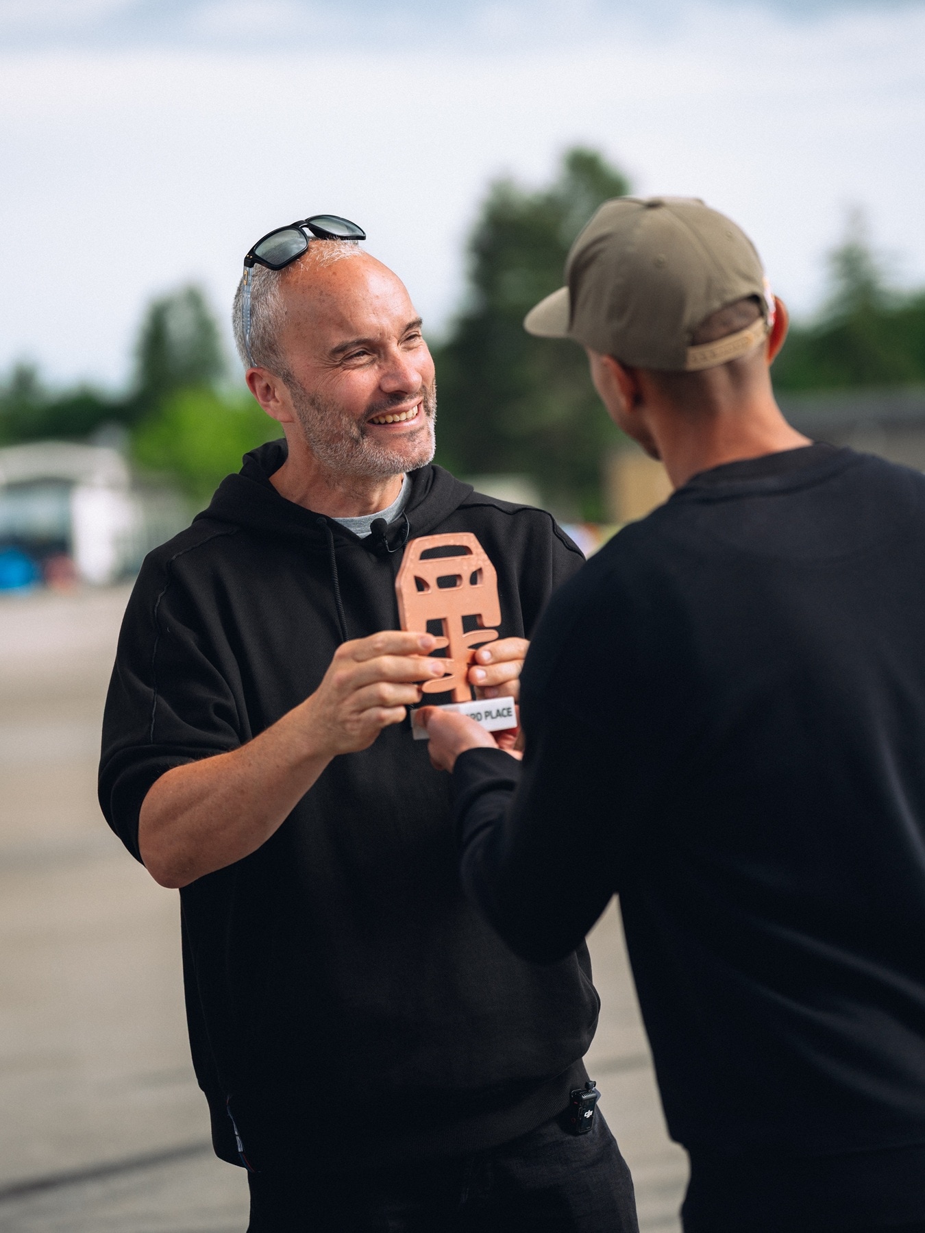 Joe Achilles receives an award from Elias Hountondji from Red Bull Driftbrothers.