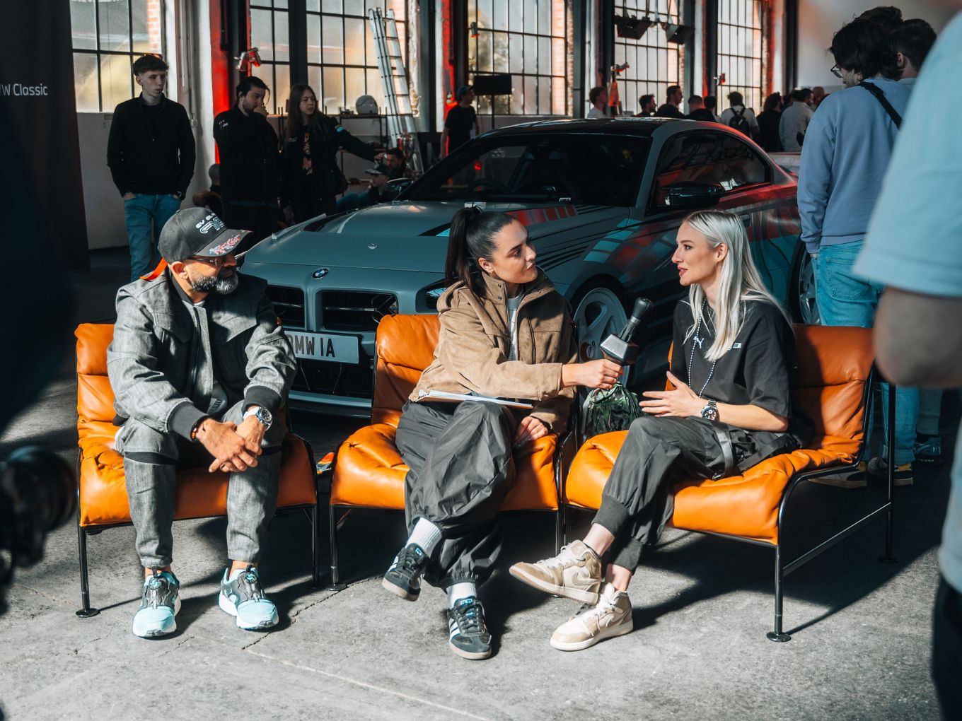 Imran Arshad and Rae Roberts during a sit-down with drift queen Becky Evans.
