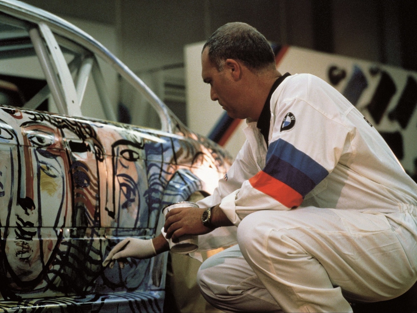 Sandro Chia in 1992, working on the raw body of the BMW M3 GTR, which was to become Art Car #13.