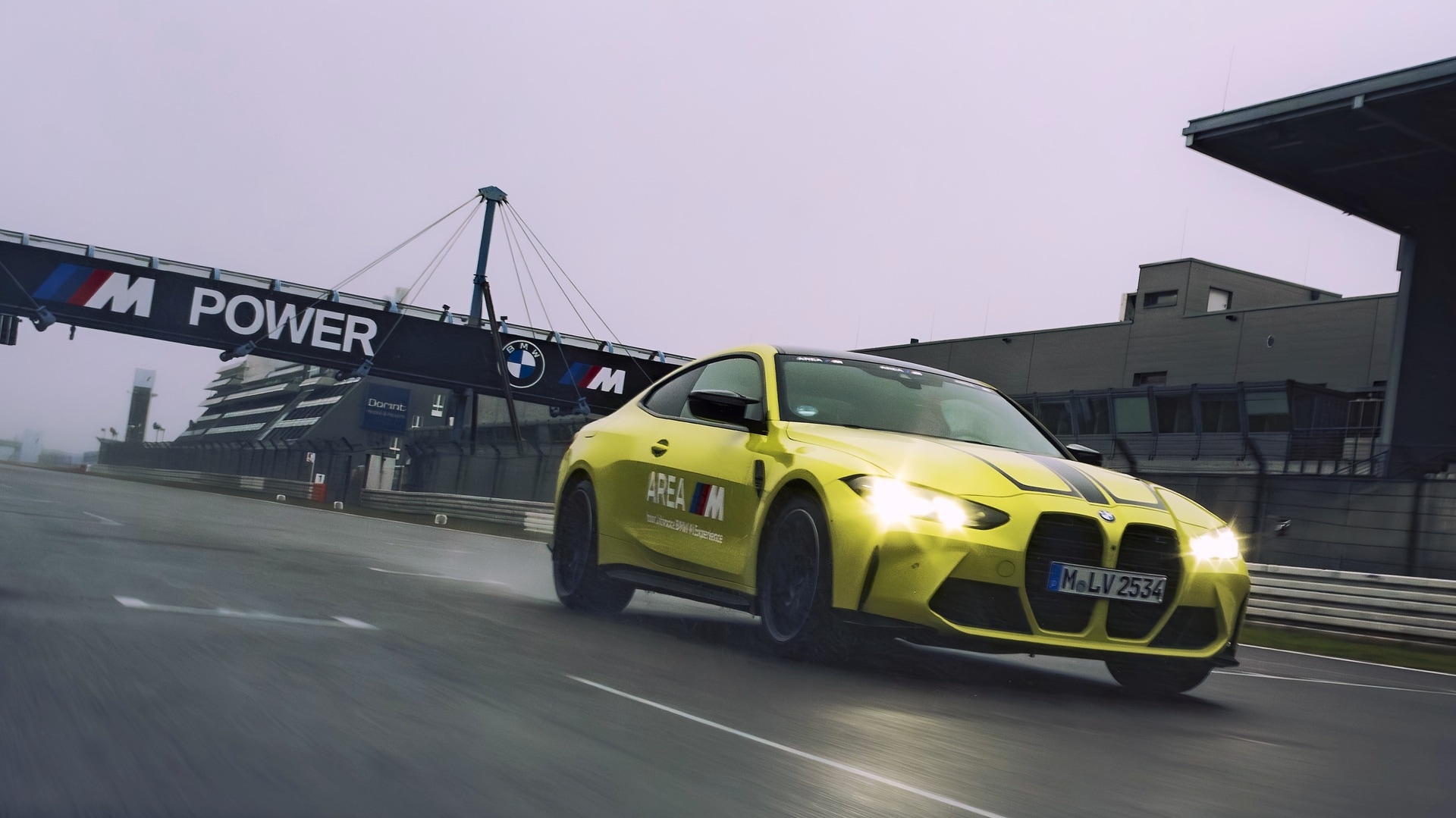 BMW M4 Competition Coupé passing the BMW M Bridge on the Nürburgring.