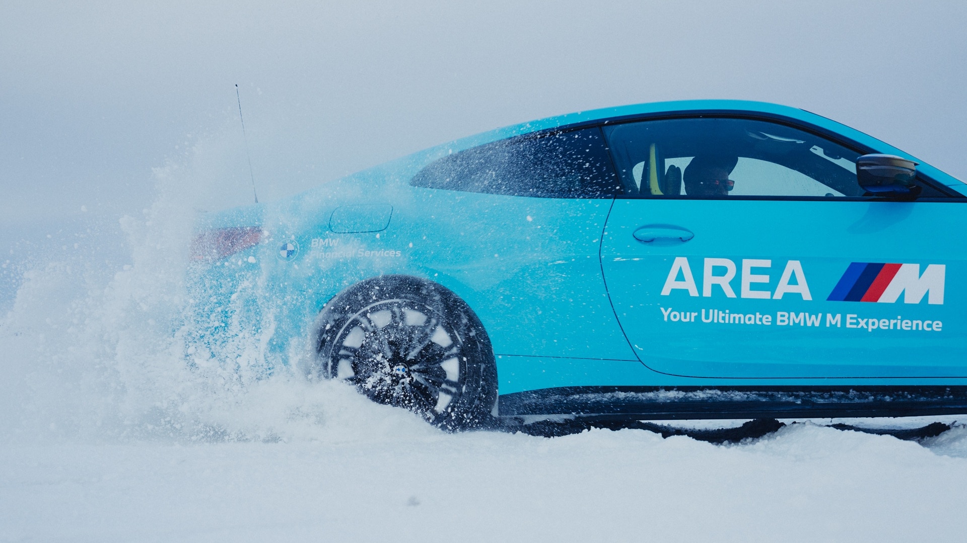 BMW M4 doing drifts on a frozen lake in the Swedish winter.