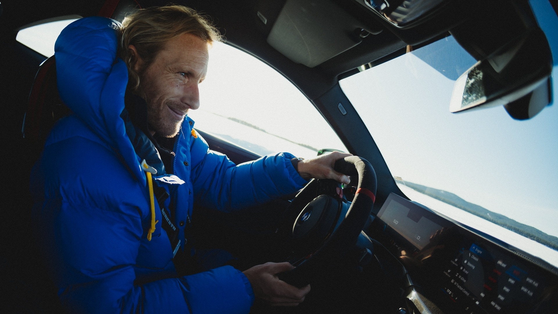 Freddie Meadows behind the wheel of a BMW M4 Competition.
