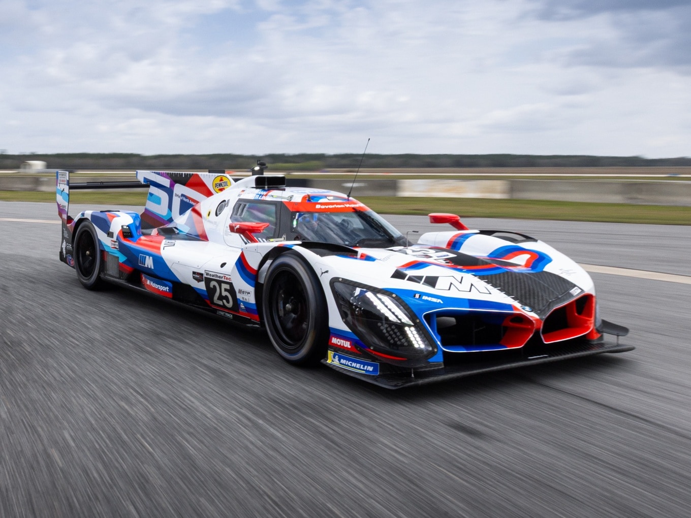 The BMW M Hybrid V8 at Sebring in 2025 in the livery commemorating 50 Years of BMW North America.