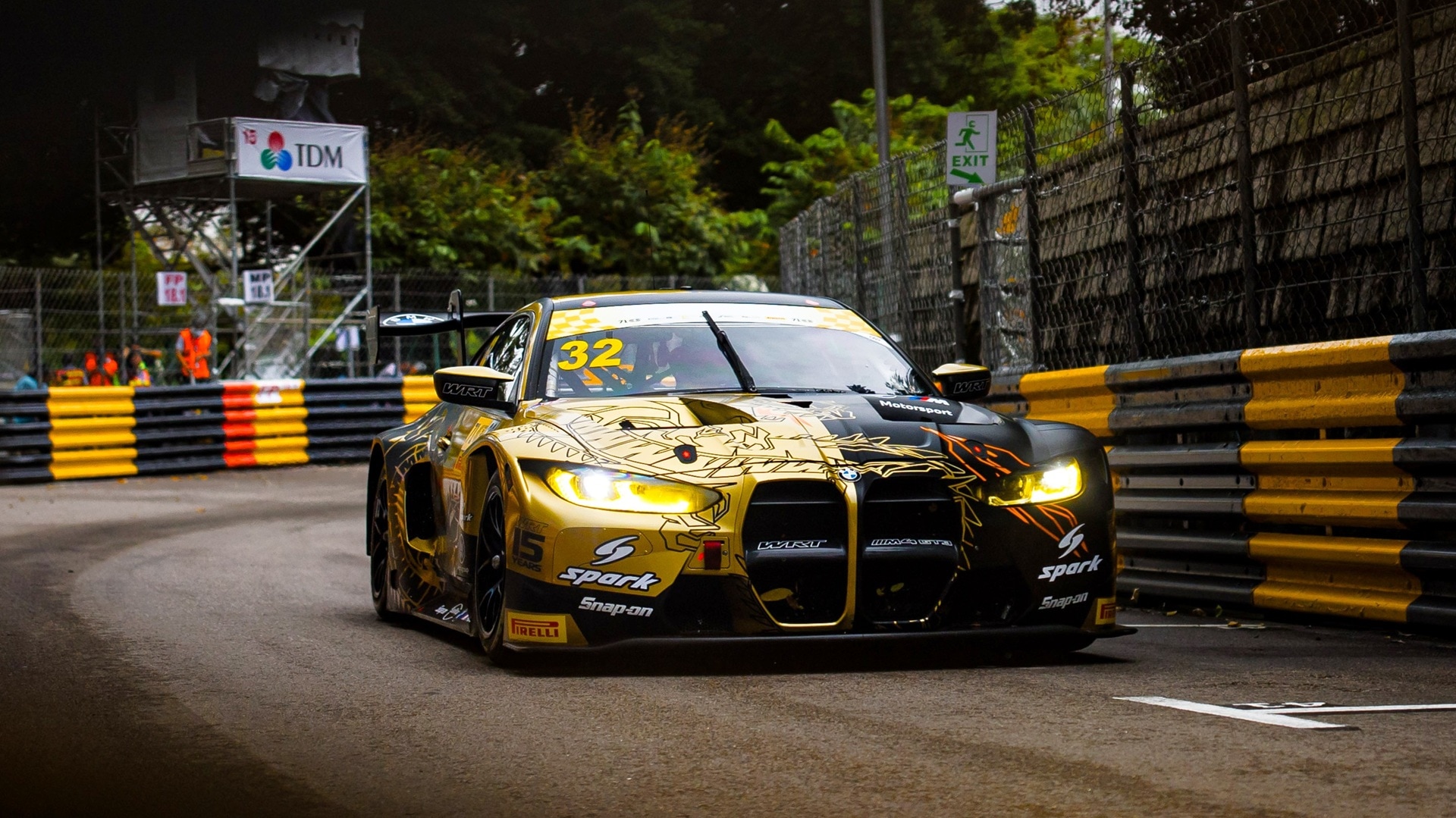 M4 GT3 in black-and-gold Livery.