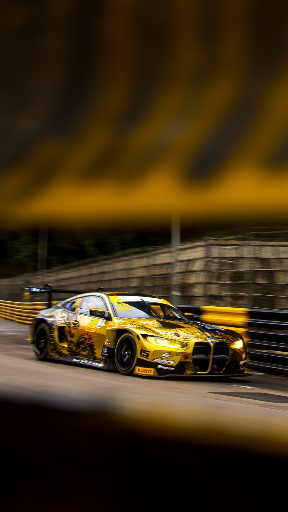 M4 GT3 in black-and-gold Livery.