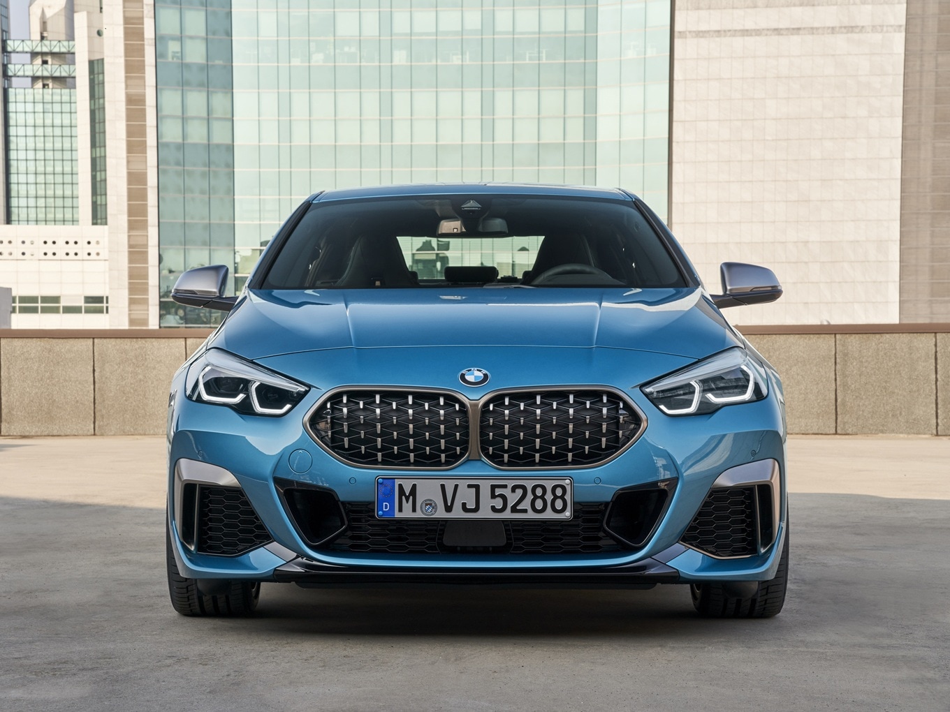 The BMW M235i xDrive Gran Coupé F44 on a rooftop car park.