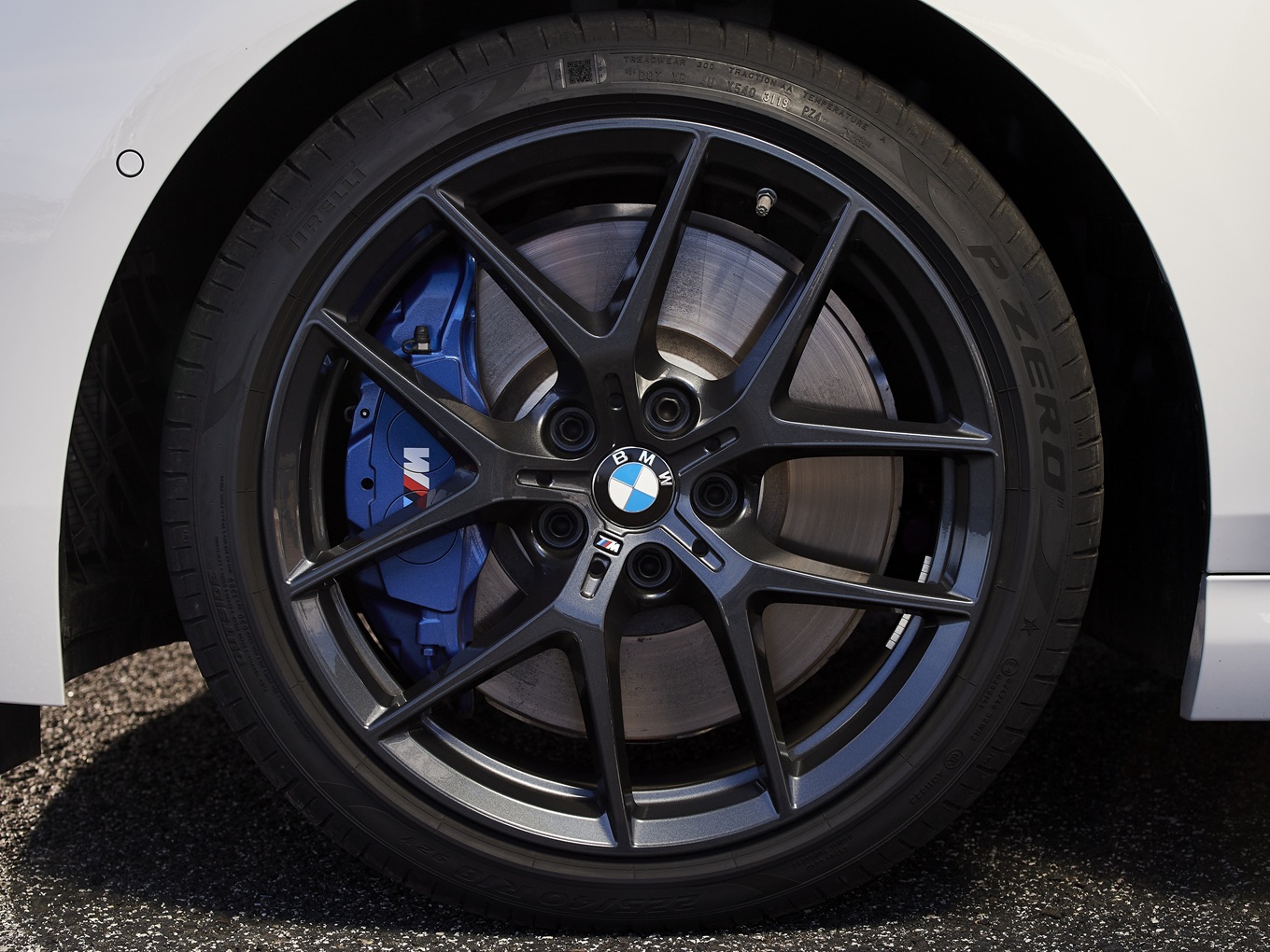 Sport brakes and optional 18-inch M Performance Y-spoke wheels 554 M Orbit Grey.