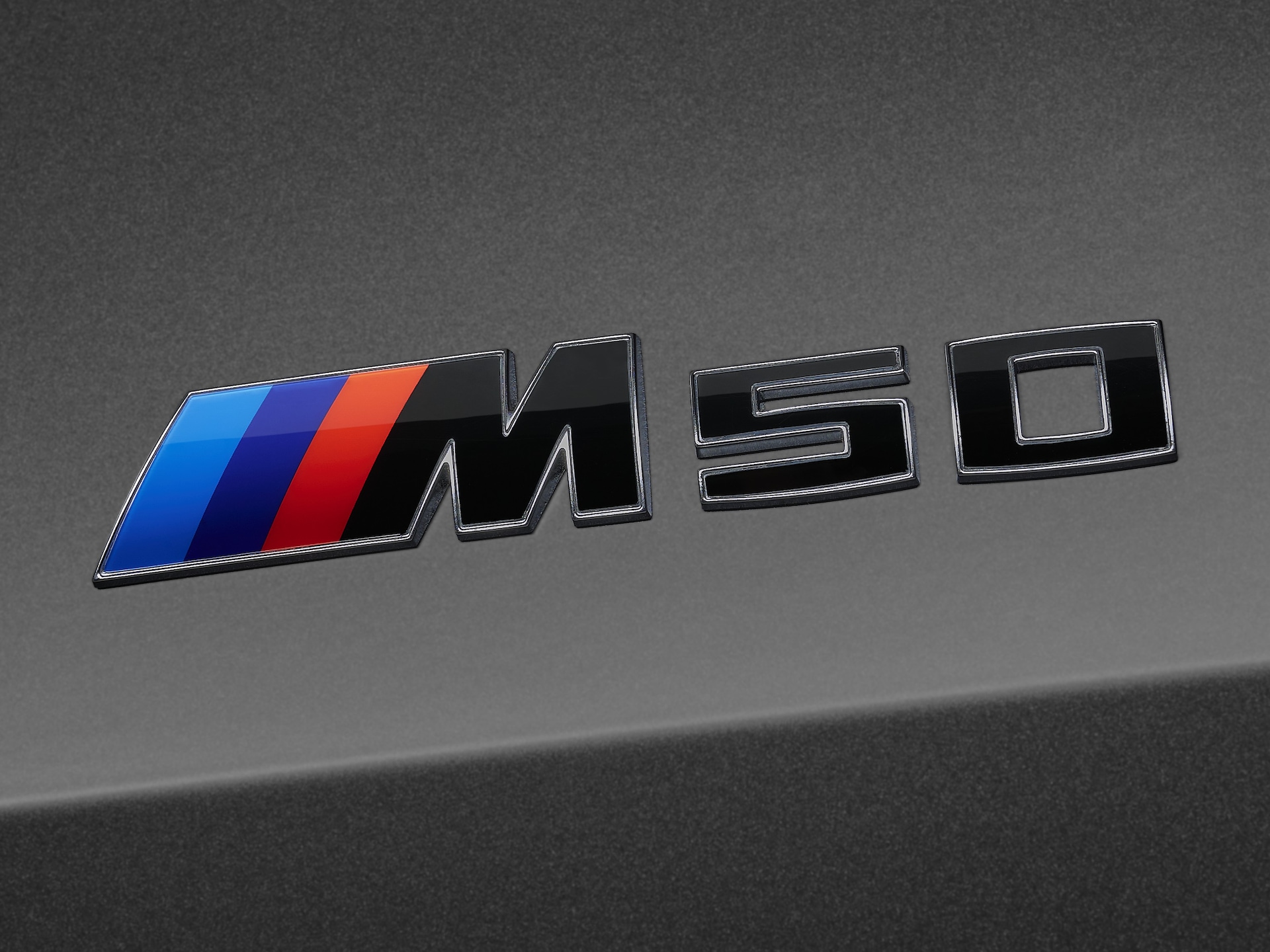 Model lettering in black with a silver outline