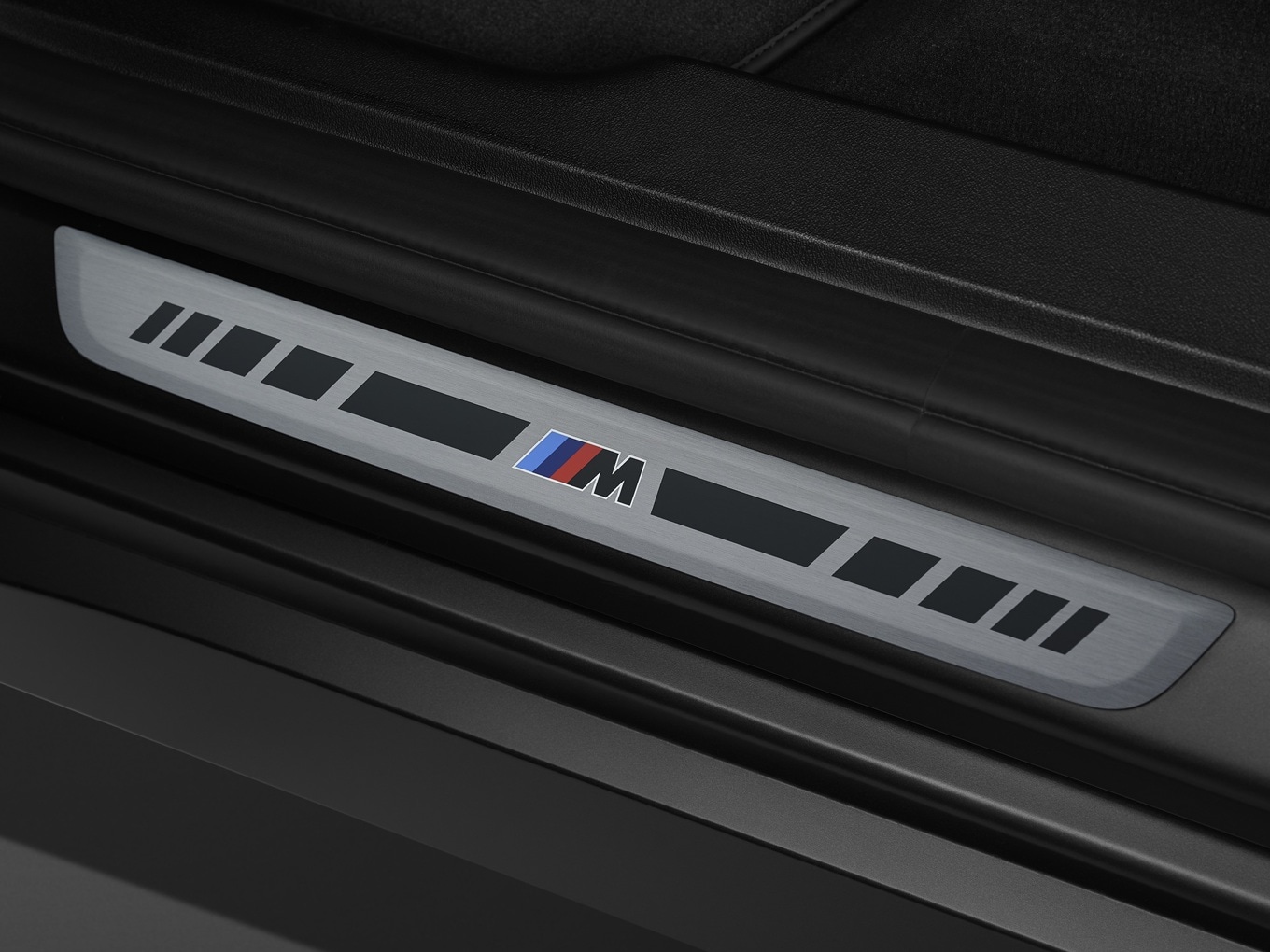 Door sills on the BMW X3 M50 with the Black Package.