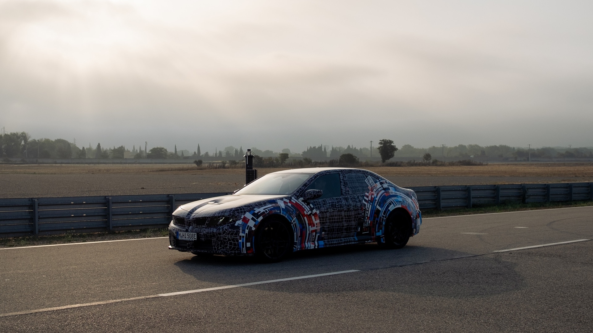 The pre-production BMW M3 standing at the test track in Miramas after completion of a test drive.