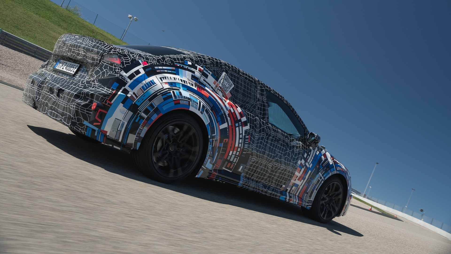 The pre-production model of the BMW M3 at the Sachsenring racetrack.