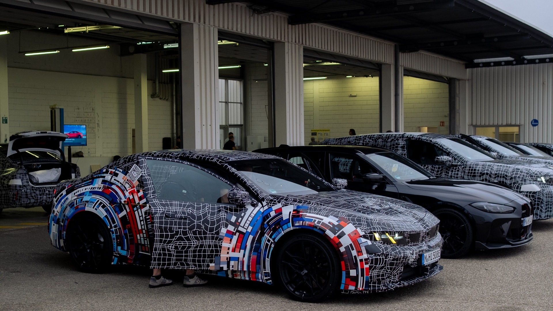 The pre-production model of the BMW M3 line dup with additional test vehicles before a workshop at the test track in Miramas.
