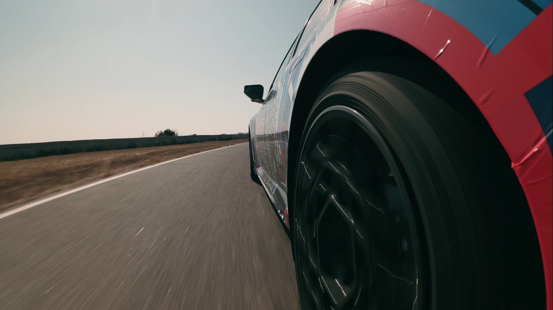 Close-up shot of the rear wheel of the pre-production BMW M3 during a test drive at Miramas.