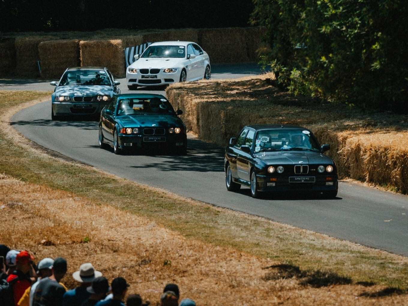 Four BMW M3 generations during the Hillcimb race at Goodwood Festival.