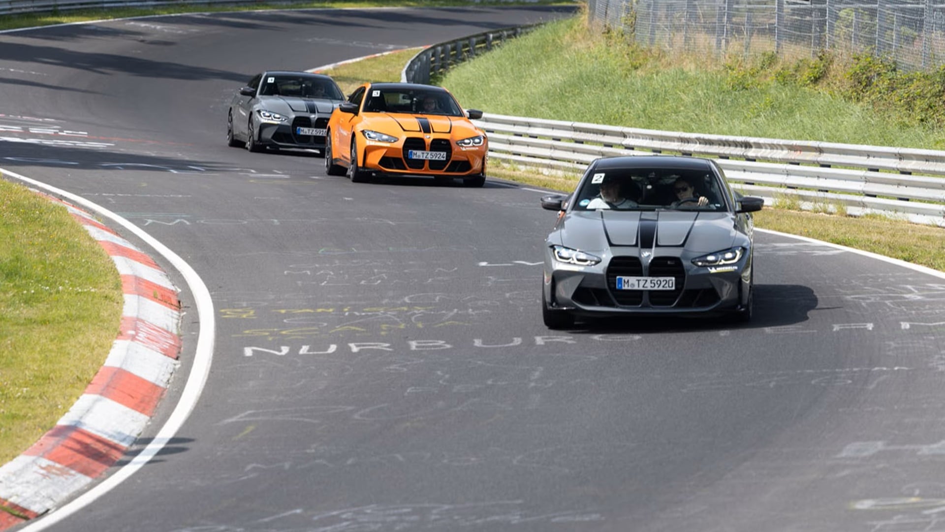 Three BMW M4during a driver's training on the Nürburgring. 