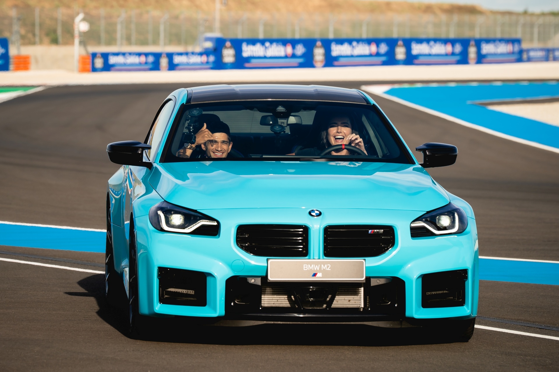 Becky Evans and Jorge Martín driving the new BMW M2 mit M xDrive